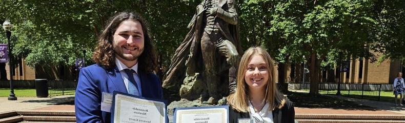 Two students hold awards received at the East Texas Regional Phi Alpha Theta Conference 2024